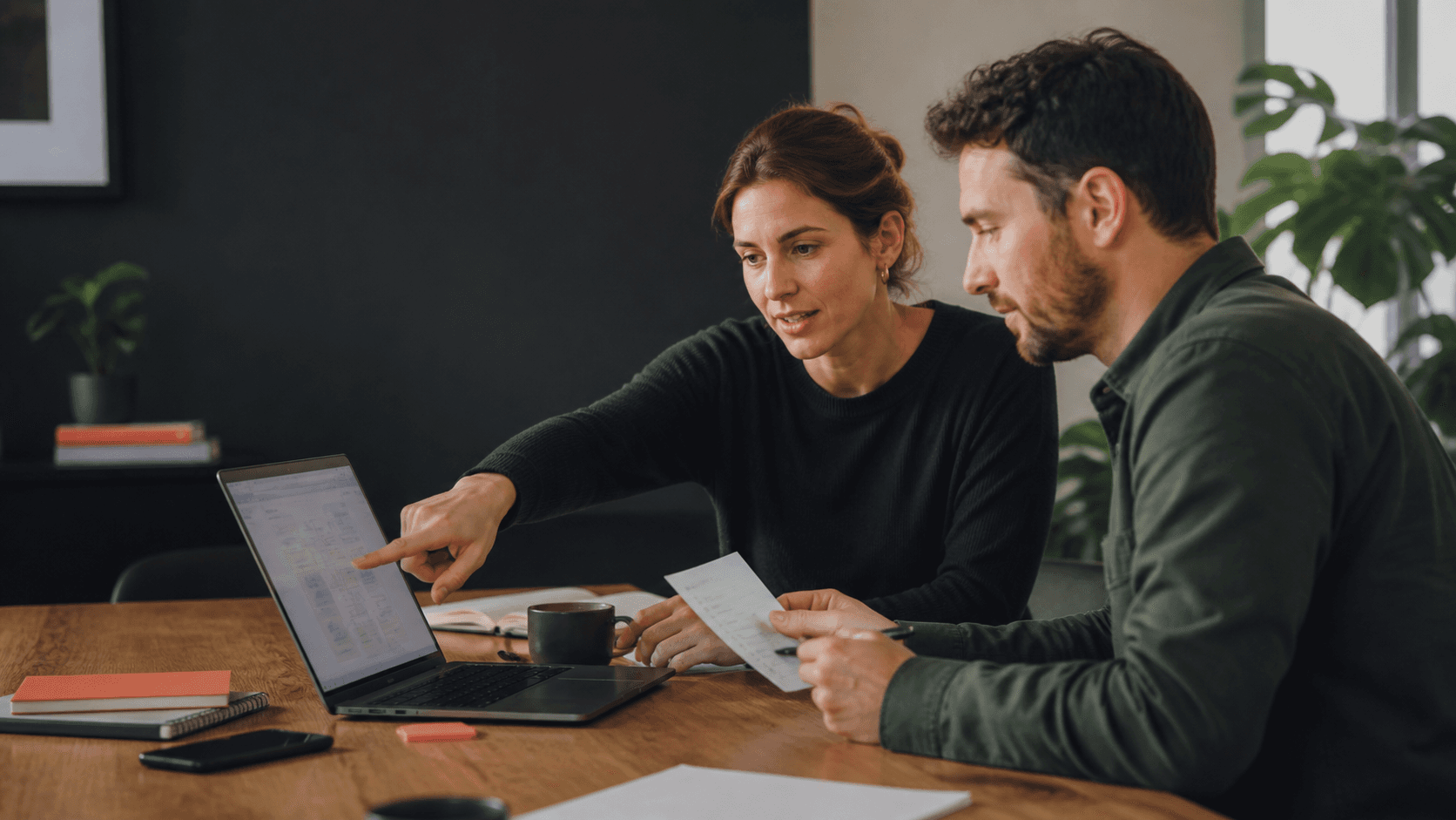 Two sales operators review an uncertain CRM case together before an automated follow-up is allowed to continue.